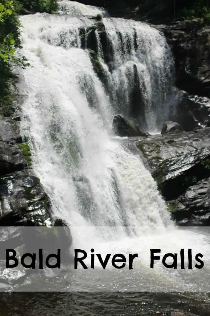 Bald River Falls waterfall rushing down over greyish brown rocks. 