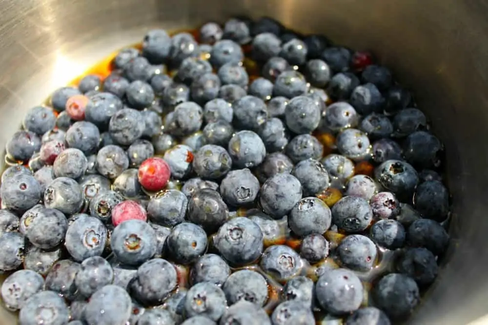 blueberries and maple syrup in a pot