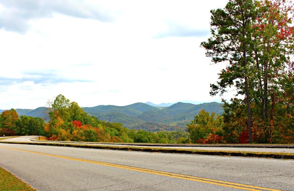 Foothills Parkway fall mountains behind a divided paved highway
