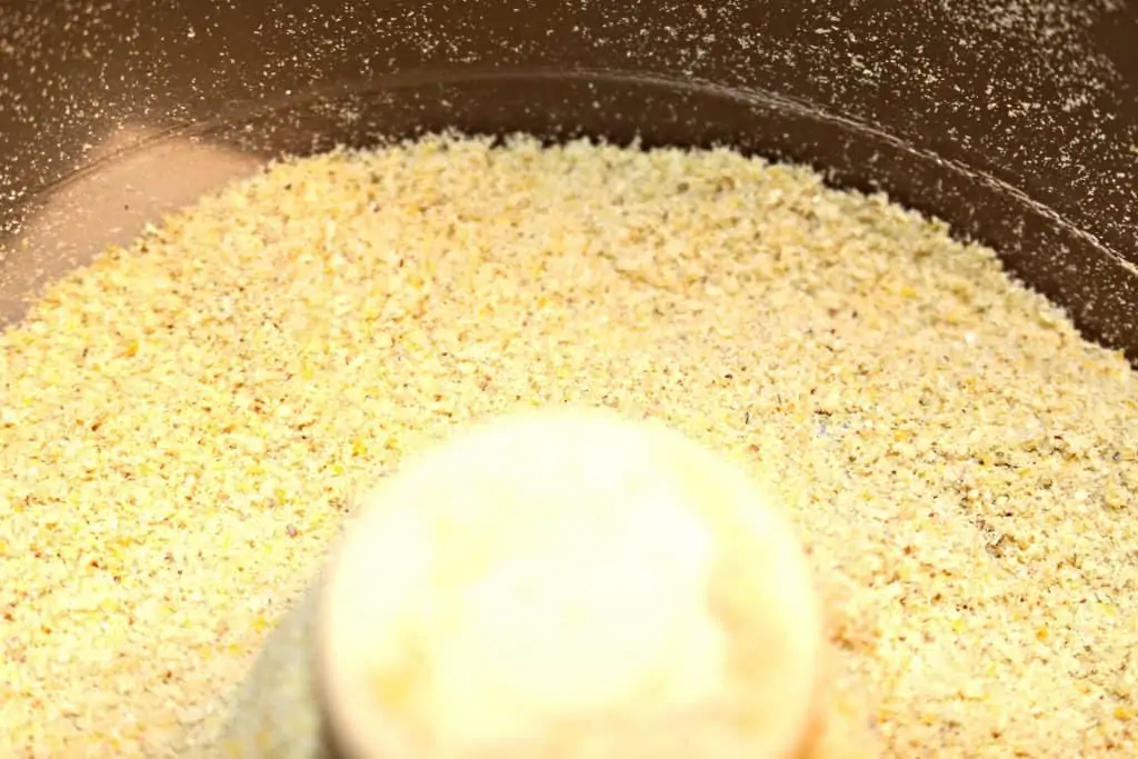 fresh ground corn meal in a food processor