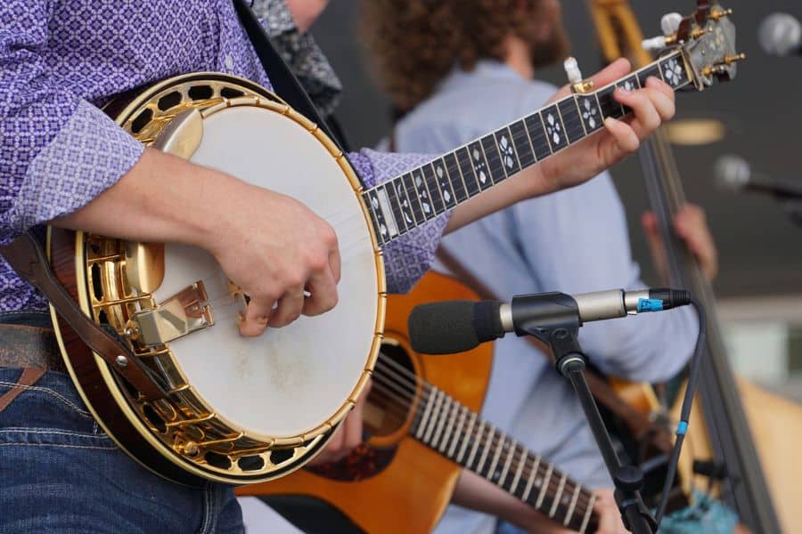 Person playing a banjo at a concert representing free concerts near Tri Cities TN