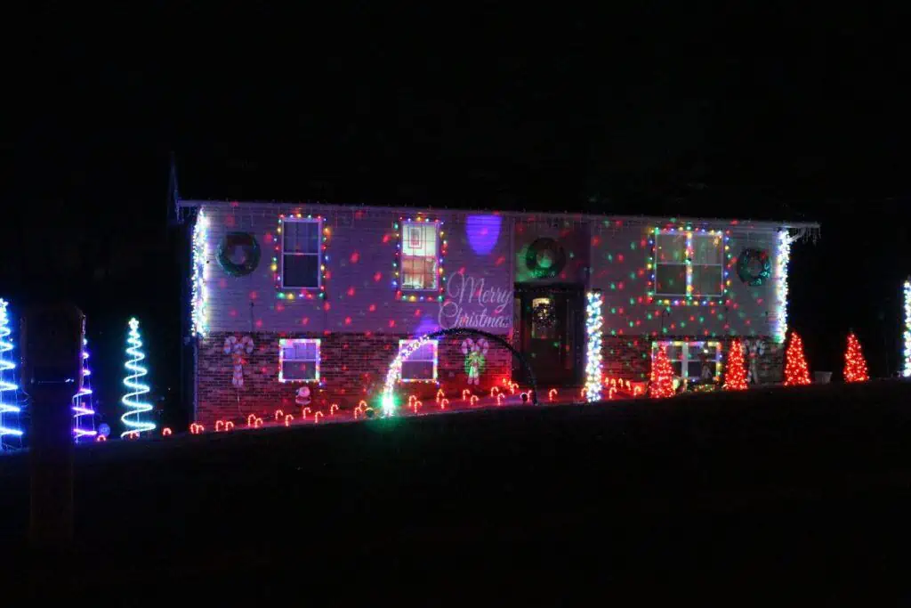 A light display with 3D Christmas trees in red and green on West Hills, Maryville TN.