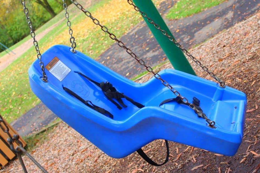 blue swing with straps for children with physical disabilities