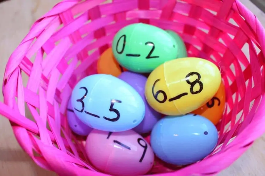 colorful plastic easter eggs with numbers written in black marker