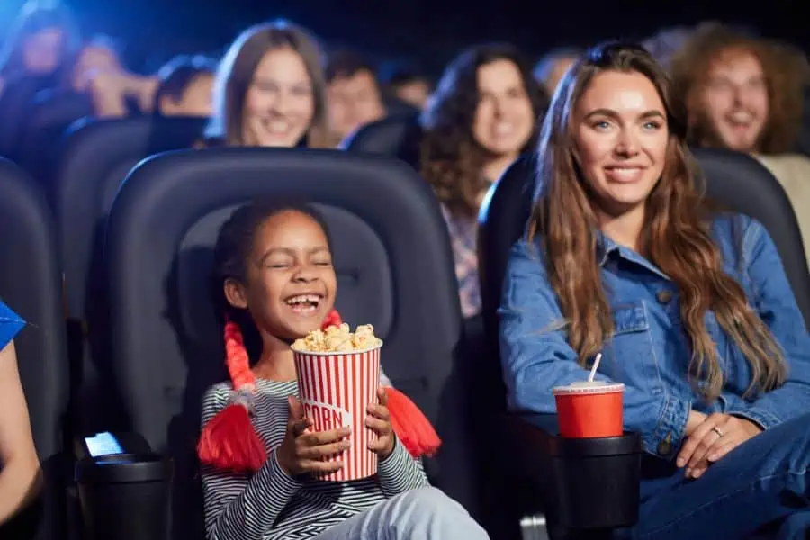 Happy mother and child at movie theater representing dollar movies Chattanooga TN