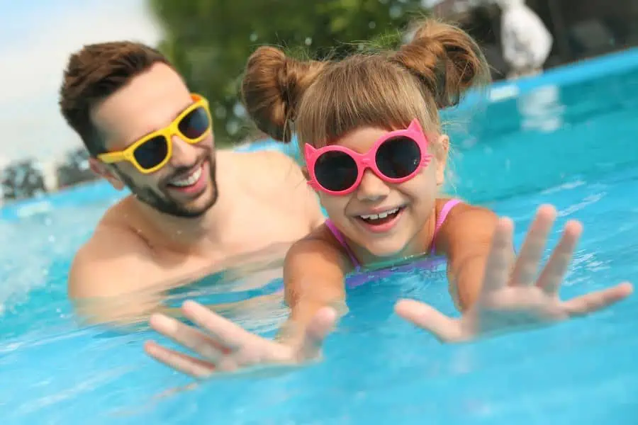 happy father and daughter in swimming pool representing public pools near Knoxville TN.