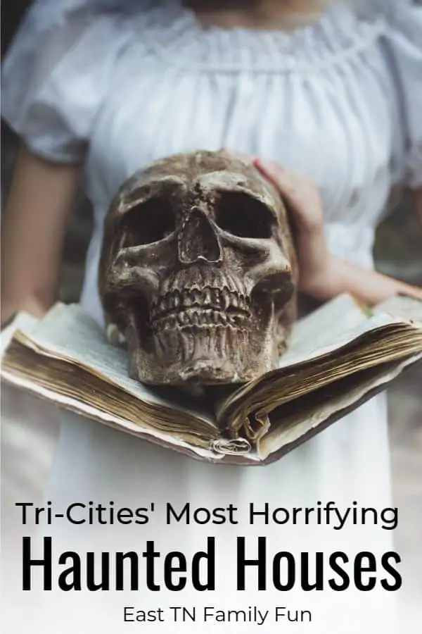 a girl holding a skull representing Most Horrifying Haunted Houses in Johnson City TN.