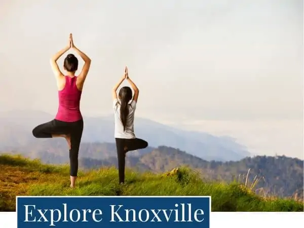 Mother and daughter exercising with a view of the mountains. Explore activities in the Knoxville area.