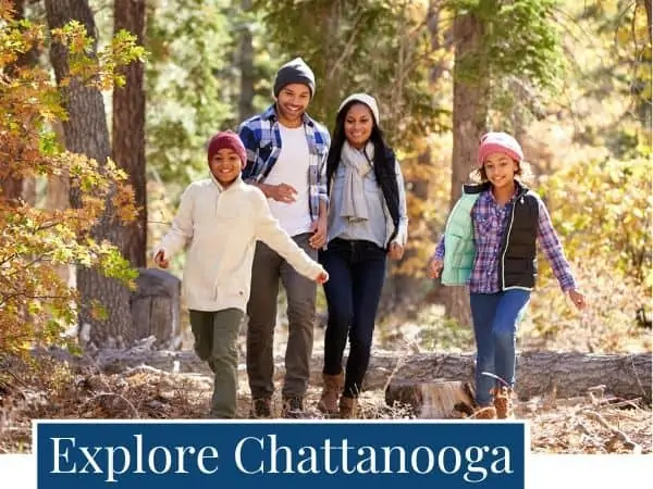 happy family hiking in the woods on a fall day. Explore activities in the Chattanooga area.