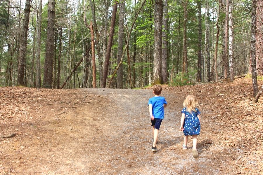 Cades Cove Activities: Children hiking on dirt trail in Cades Cove