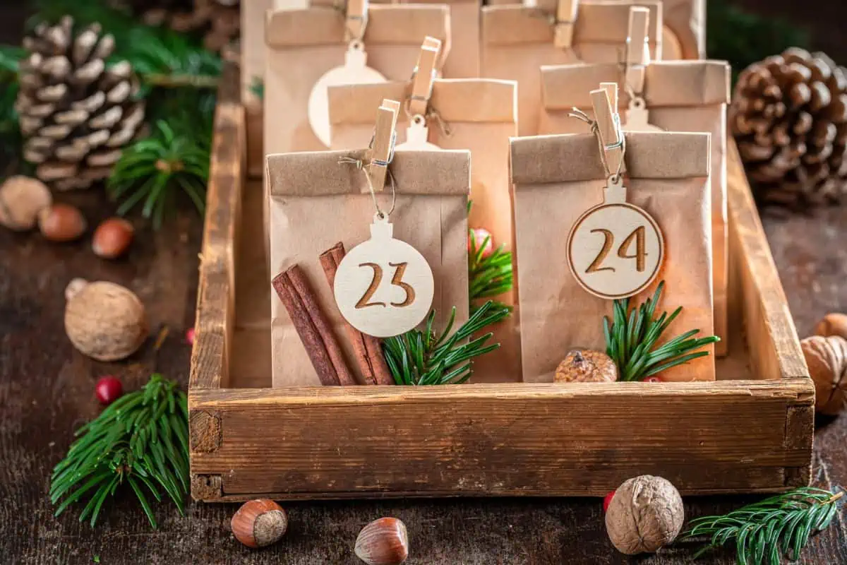 Rustic advent calender made from paper bags and burned wood numbers representing Christmas craft fairs near Knoxville TN.