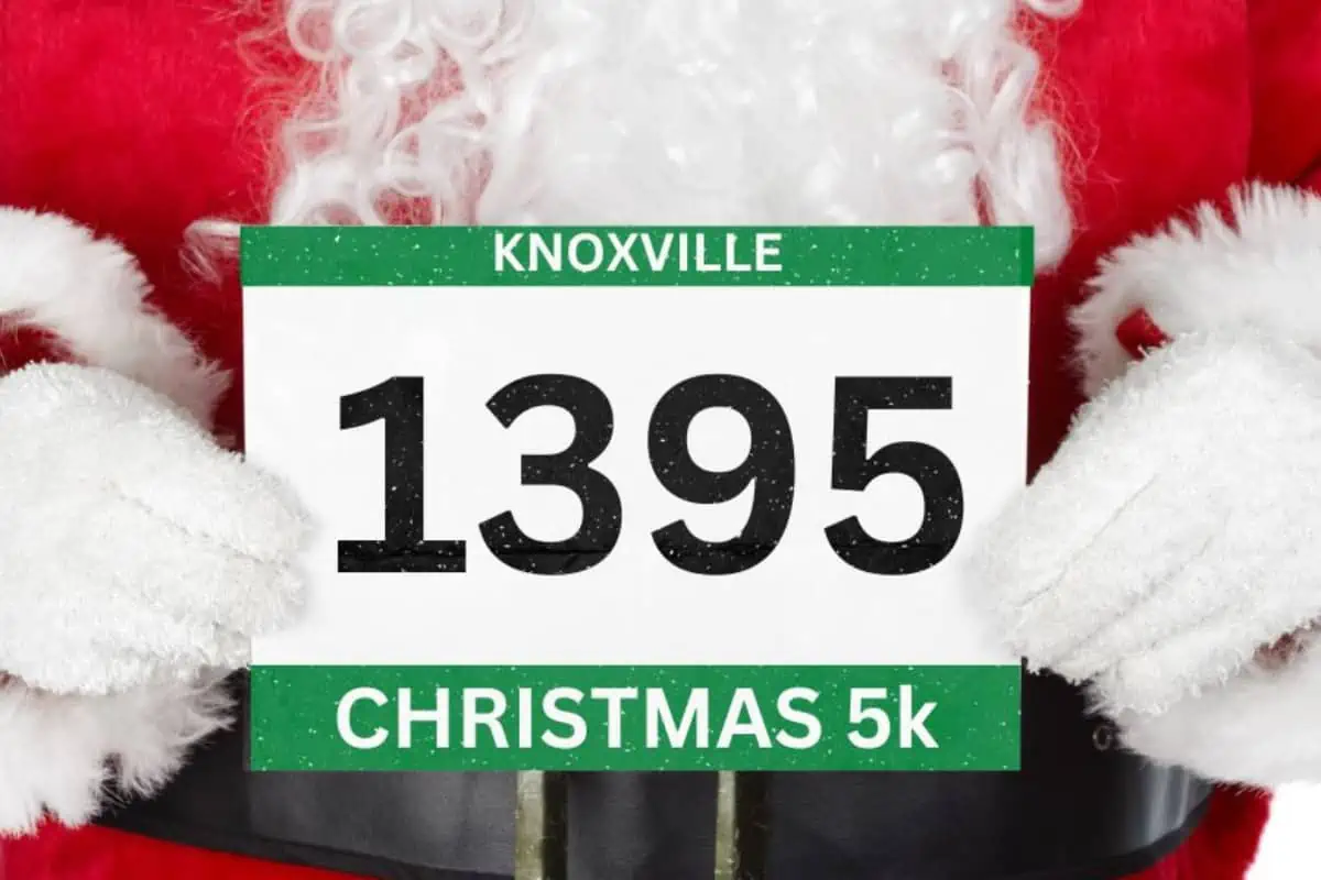 Santa holding a Knoxville Christmas 5k race number with green trim